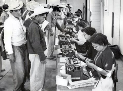 Image of Temporary clerks typed I-100(a) & (b) and fingerprint cards after obtaining necessary information from the applicant. All clerks were proficient in both English and Spanish.  Rio Vista Reception Center, El Paso, Texas.